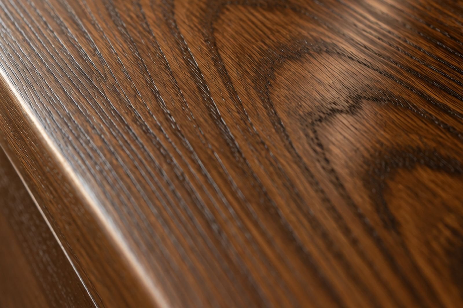 Close view of quarter-sawn oak grain under a satin finish